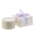 Elegant cream candle with gold Arabic script, paired with lavender ribbon gift box.