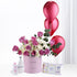Pink roses and balloons celebrate baby girl arrival with Johnson’s baby essentials.