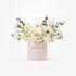 Elegant white rose and eucalyptus bouquet in blush "Congratulations" cylinder.