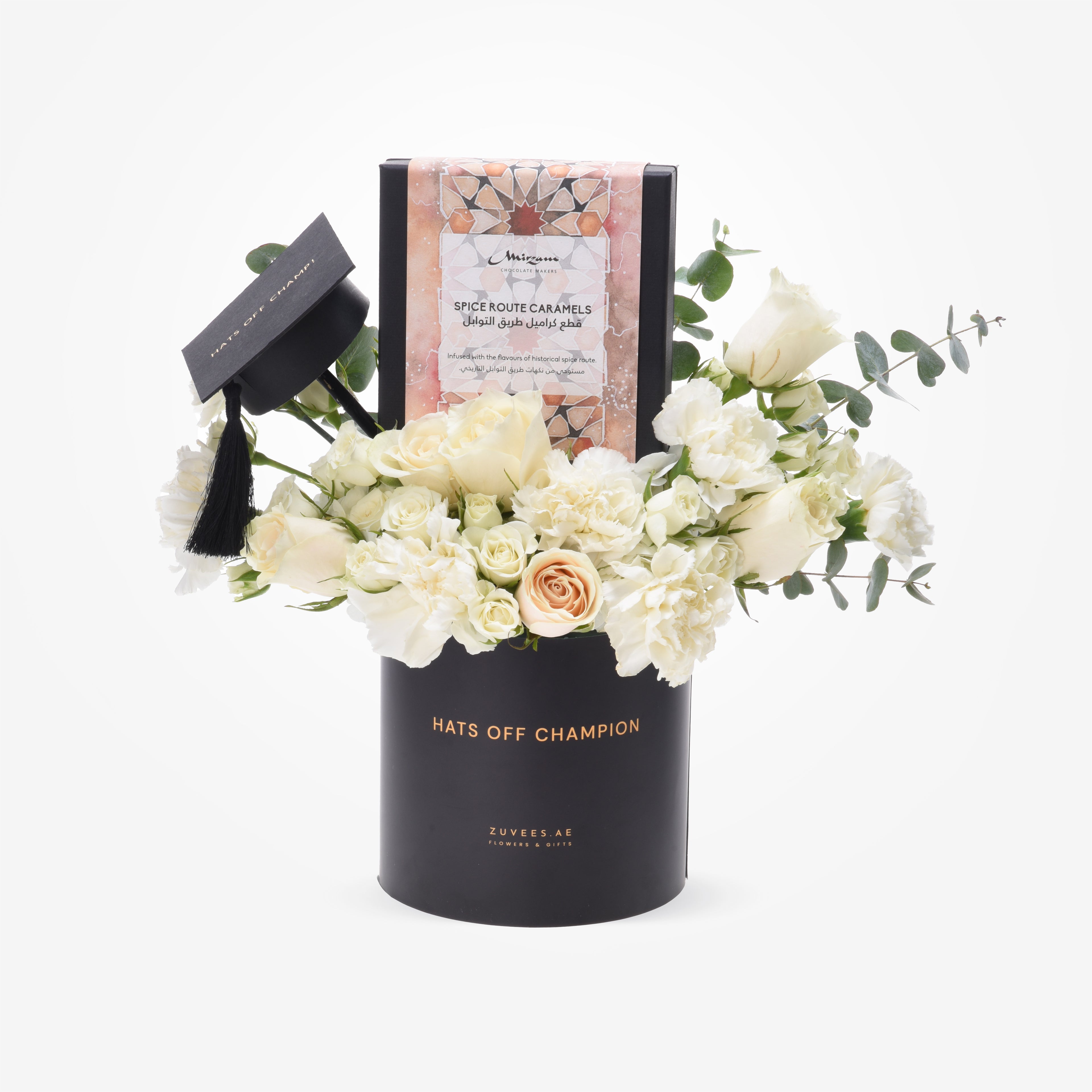 Elegant black graduation-themed floral arrangement with white roses, accented by a mini cap and "Hats Off Champion" text.