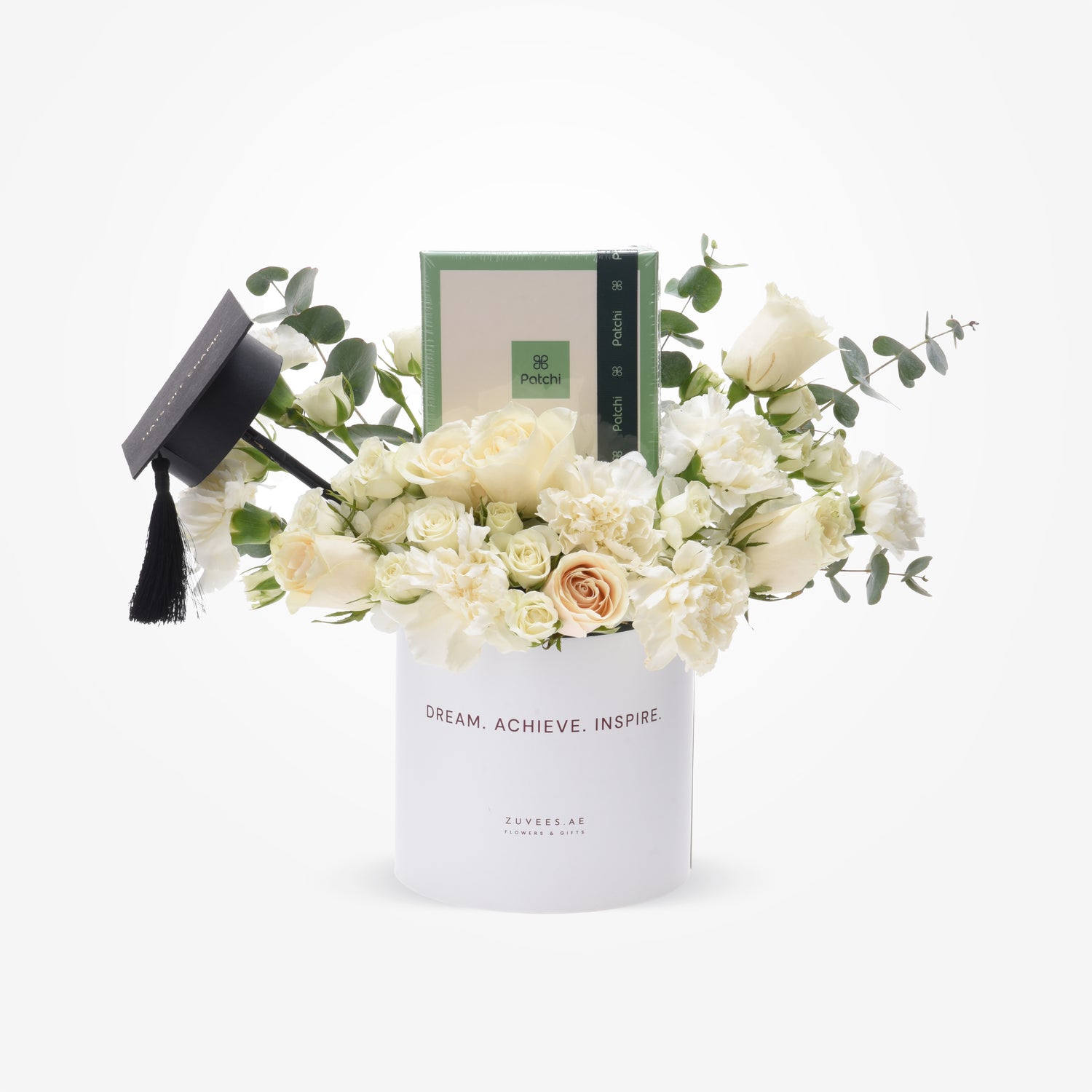 Elegant white floral graduation gift with mini cap and Patchi candle.
