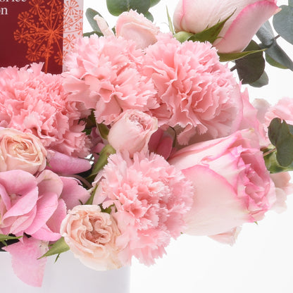 Soft pink carnations and roses with eucalyptus, elegant and romantic.