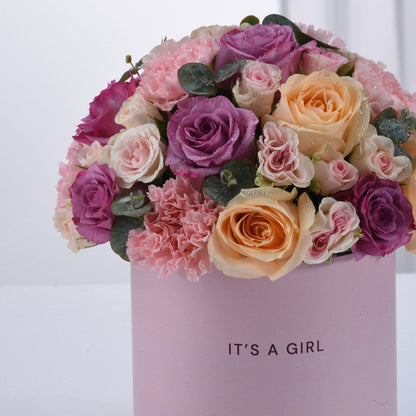 Pink and purple roses with carnations in a "It&