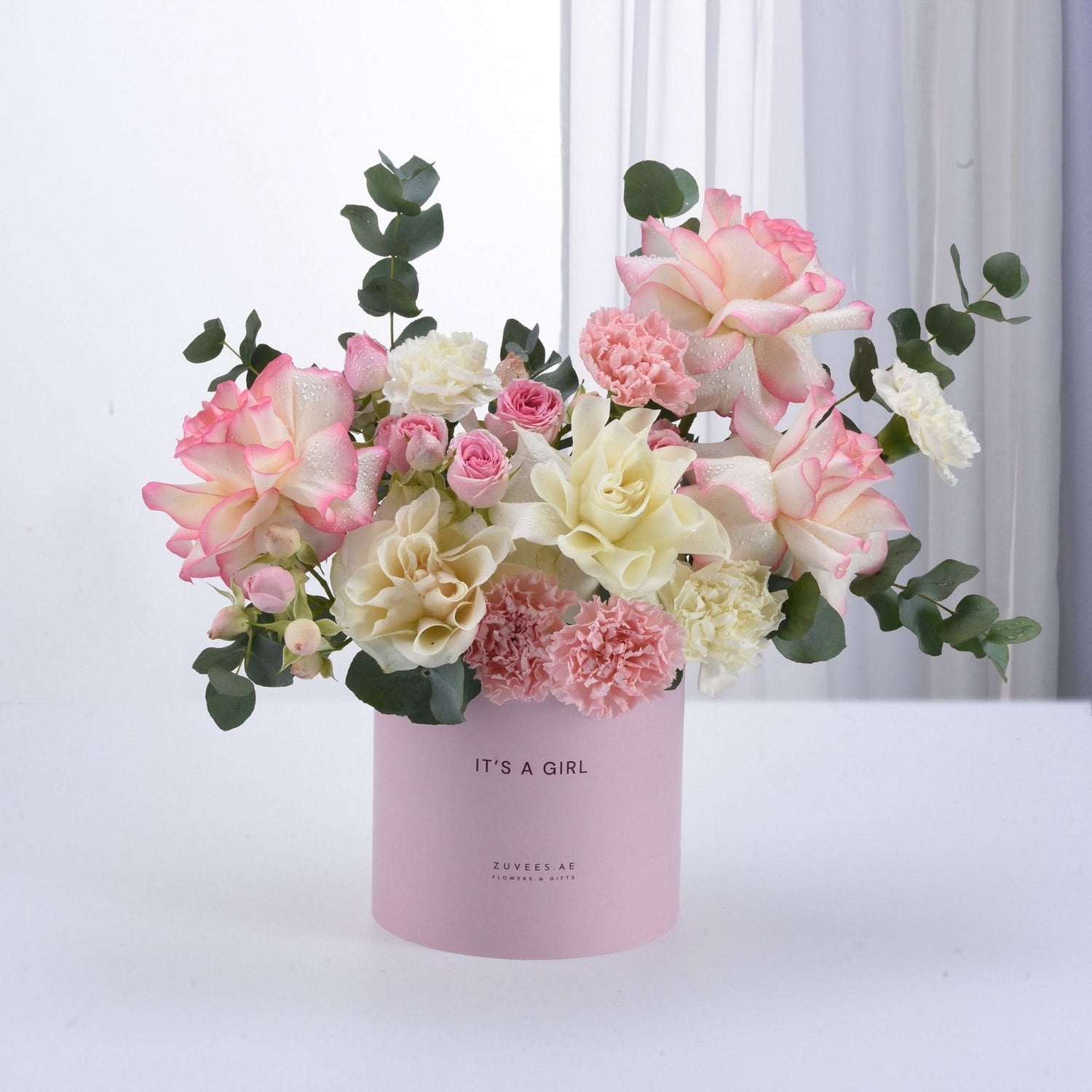 Soft pink and white roses, carnations, and eucalyptus in pastel pink "It&