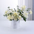 Elegant white roses and carnations in sleek white cylindrical gift box.