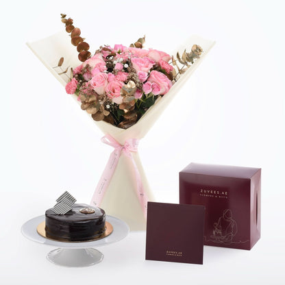 Pink roses and chocolate cake gift set with elegant packaging.