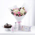 Pink roses and hydrangeas bouquet with chocolate cake and Johnson’s baby care products.