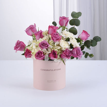 Pink roses and hydrangeas in blush box reading "Congratulations".