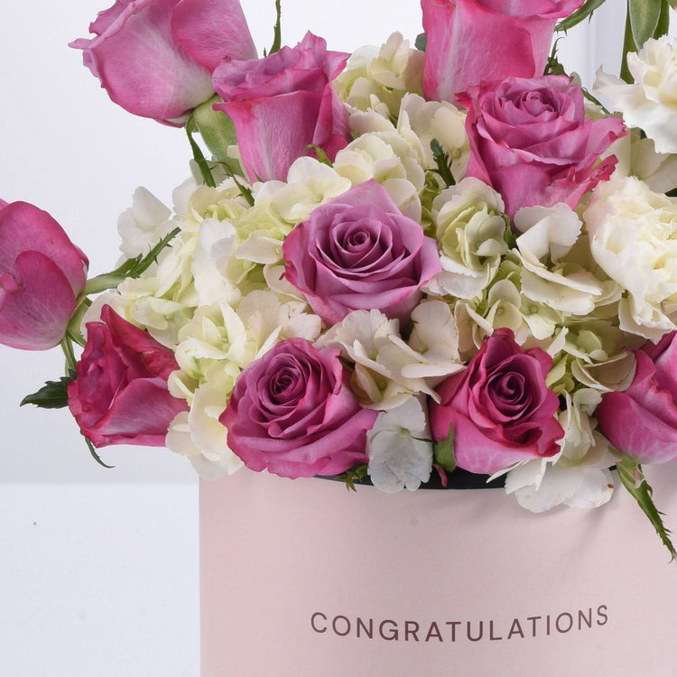 Pink roses, white hydrangeas in elegant pink "CONGRATULATIONS" box, perfect gift bouquet.