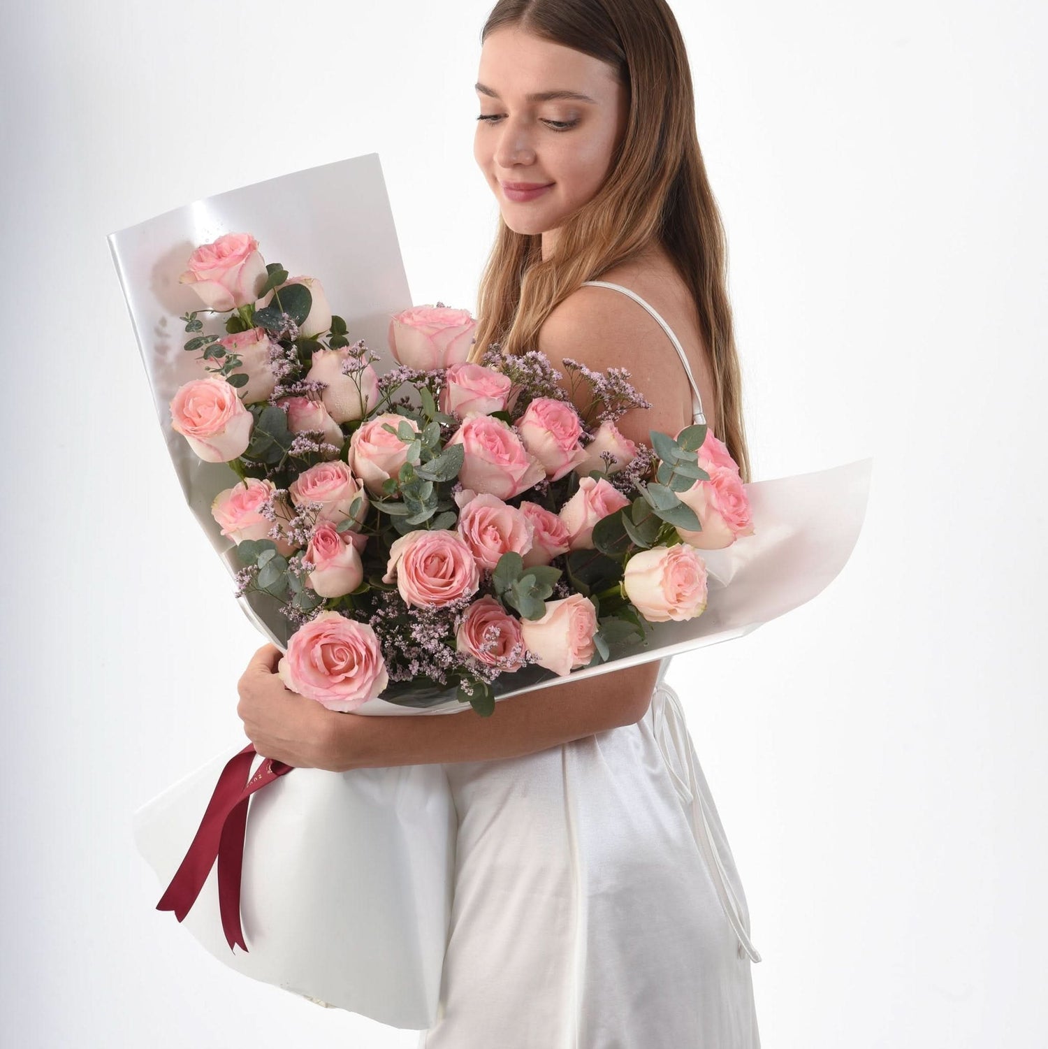 Soft pink roses, eucalyptus, and baby&