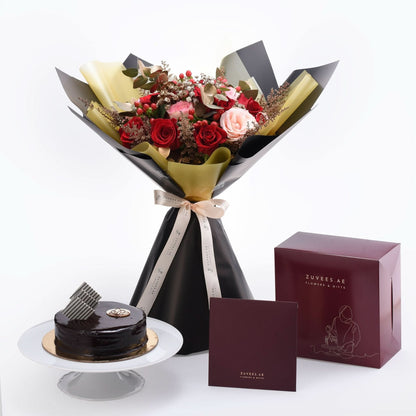 Luxurious red and pink rose bouquet with chocolate cake and branded gift box.