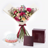 Vibrant pink, peach, and white roses with baby’s breath, elegantly wrapped in cream paper and burgundy ribbon, paired with a rose-iced cake and branded gift box.