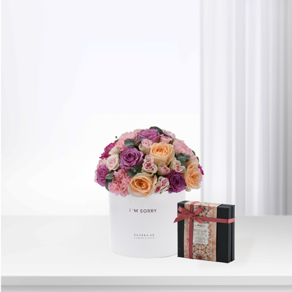White box holds vibrant pink, purple, peach roses with "I&
