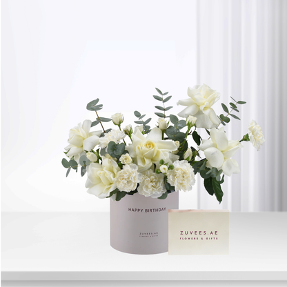 Elegant white roses and eucalyptus in blush box, "Happy Birthday" gift.
