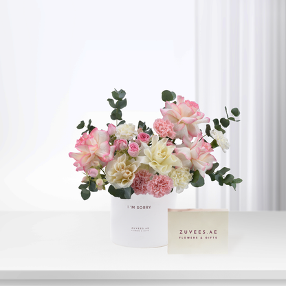Soft pink and cream roses with eucalyptus in white vase, "I&
