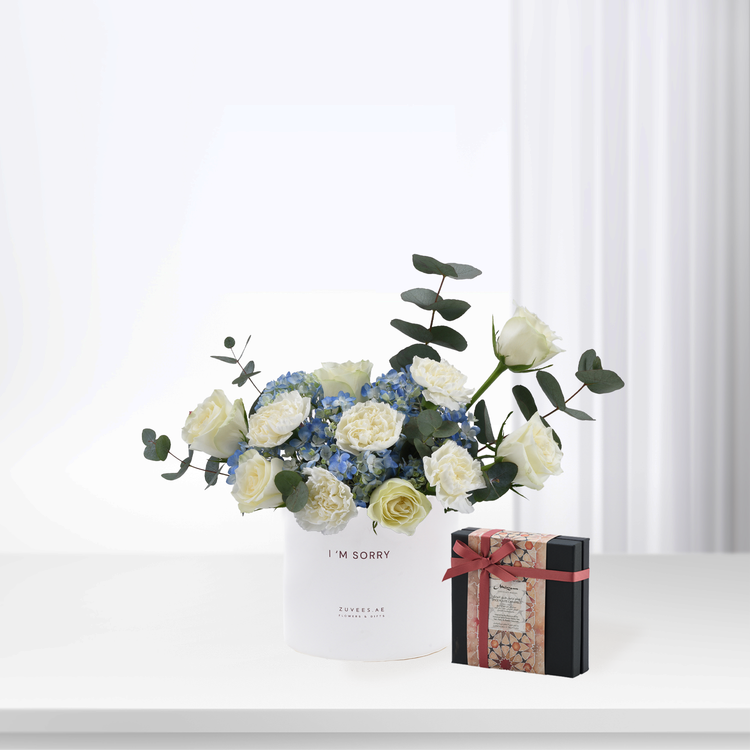 White roses and blue hydrangeas in "I&