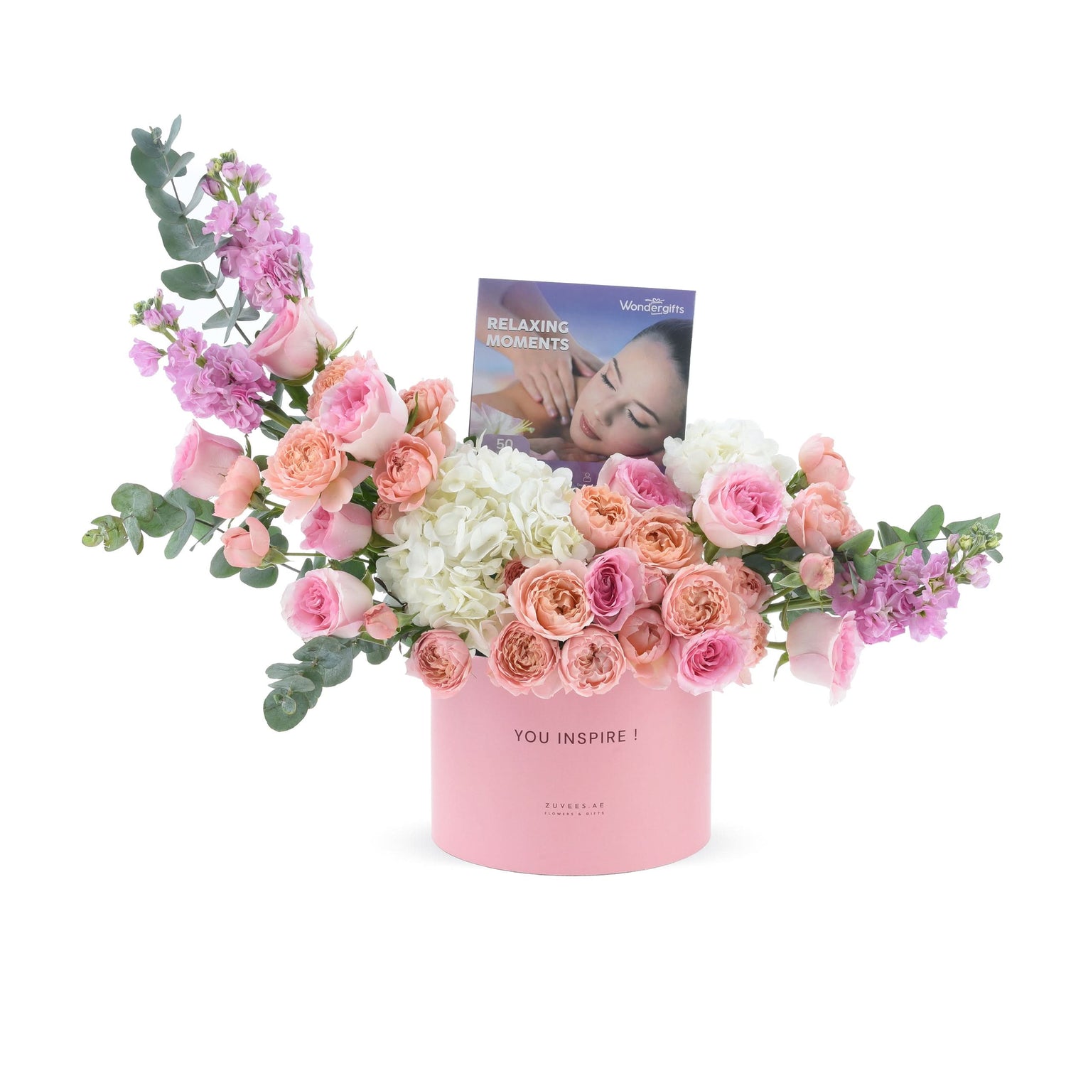 Soft pink roses, hydrangeas, and eucalyptus in a pastel pink box with “YOU INSPIRE!” message.