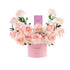 Soft pink roses in round box with “YOU INSPIRE!” message and Chanel perfume.