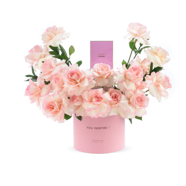 Soft pink roses in round box with “YOU INSPIRE!” message and Chanel perfume.