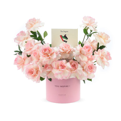 Soft pink roses in pastel pink cylinder, “You Inspire” card included.