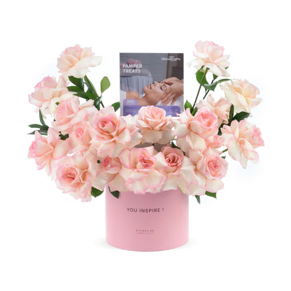 Soft pink roses in round box with "You Inspire!" message and pamper treats.