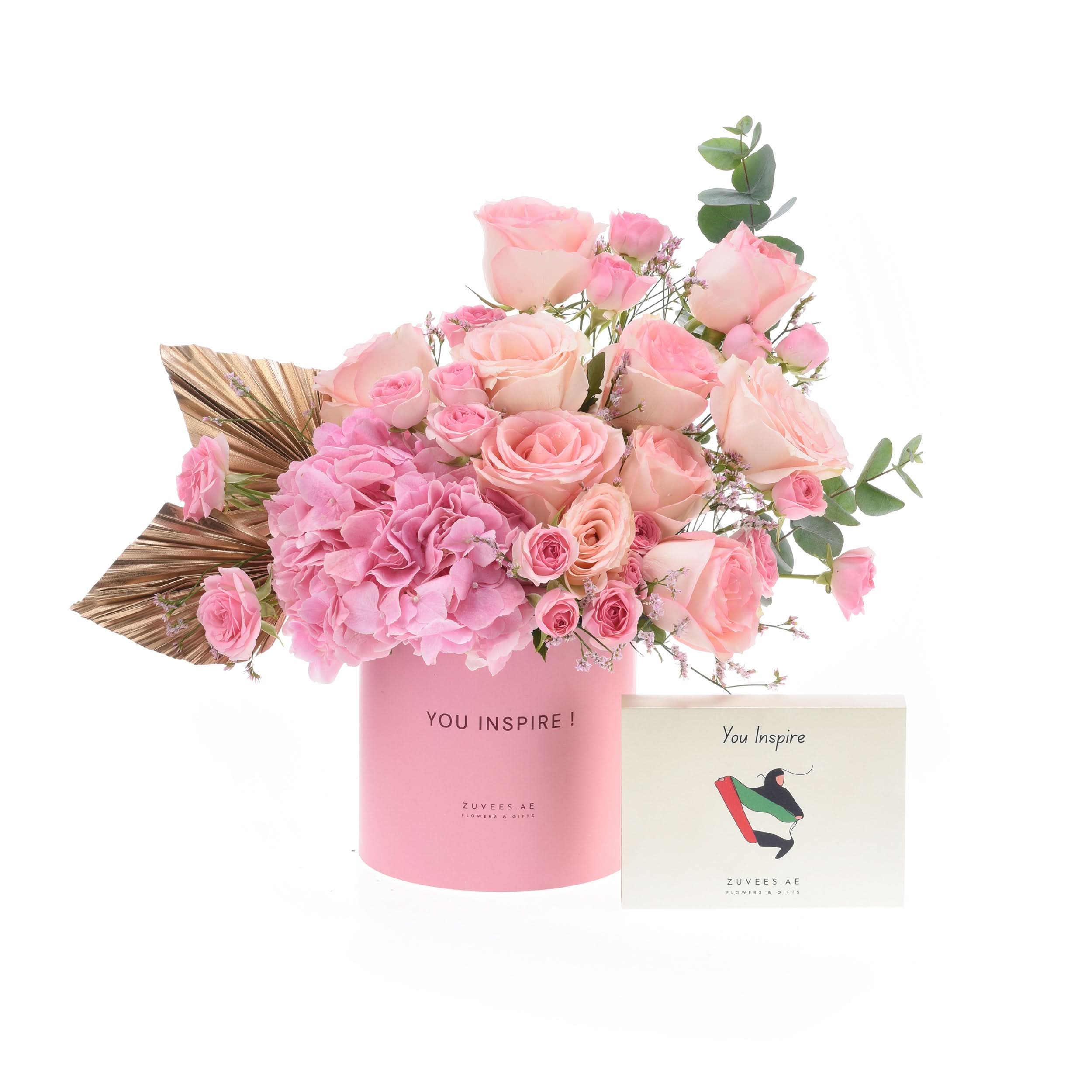 Soft pink roses and hydrangeas in a branded pink box with matching card.