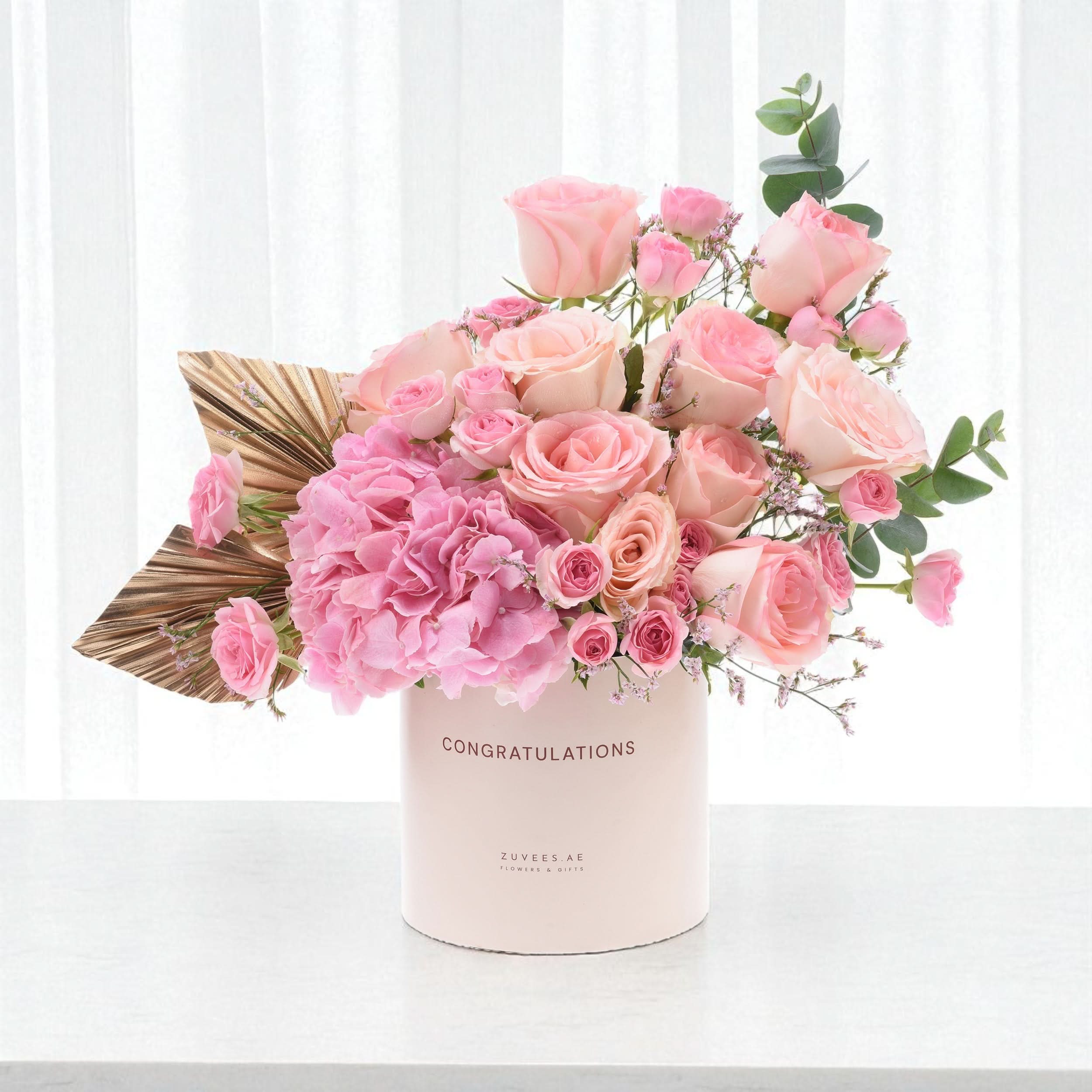 Soft pink roses and hydrangeas in "Congratulations" box with gold leaf accent.