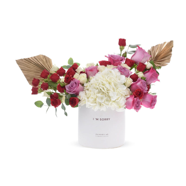 White cylindrical vase with "I&