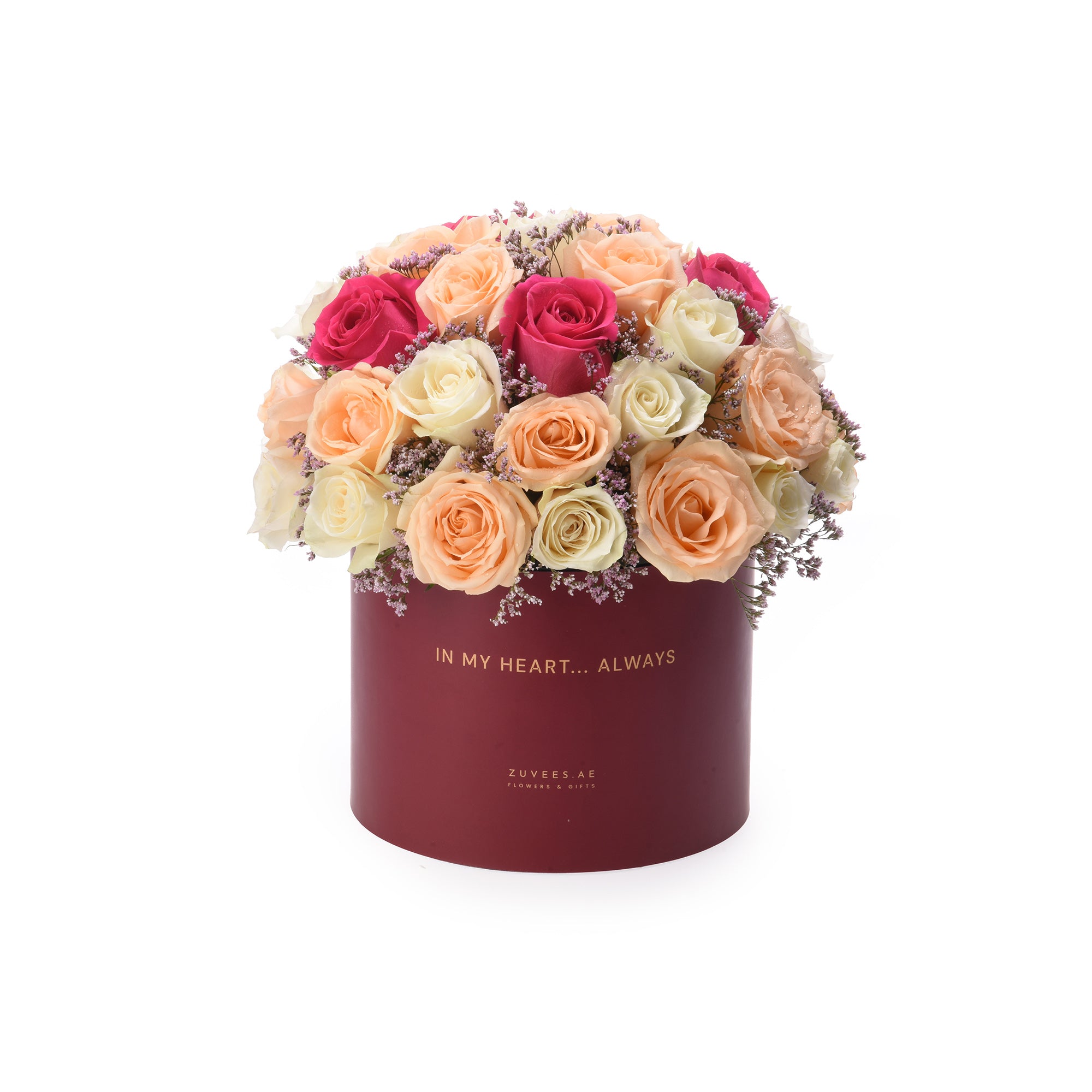 Vibrant rose bouquet in burgundy box with "In My Heart... Always" inscription.