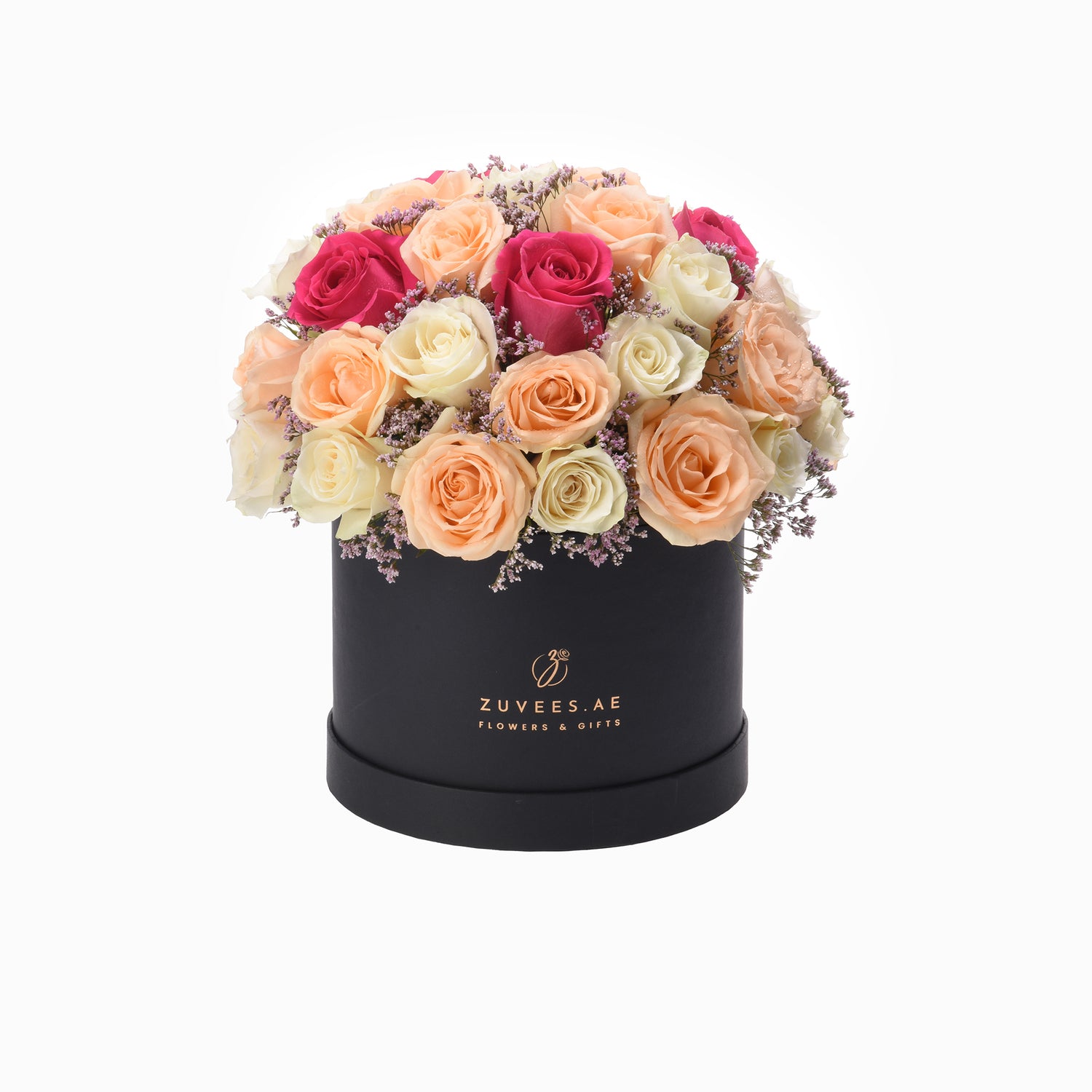Elegant black hat box filled with vibrant peach, pink, and cream roses accented with delicate purple filler flowers.