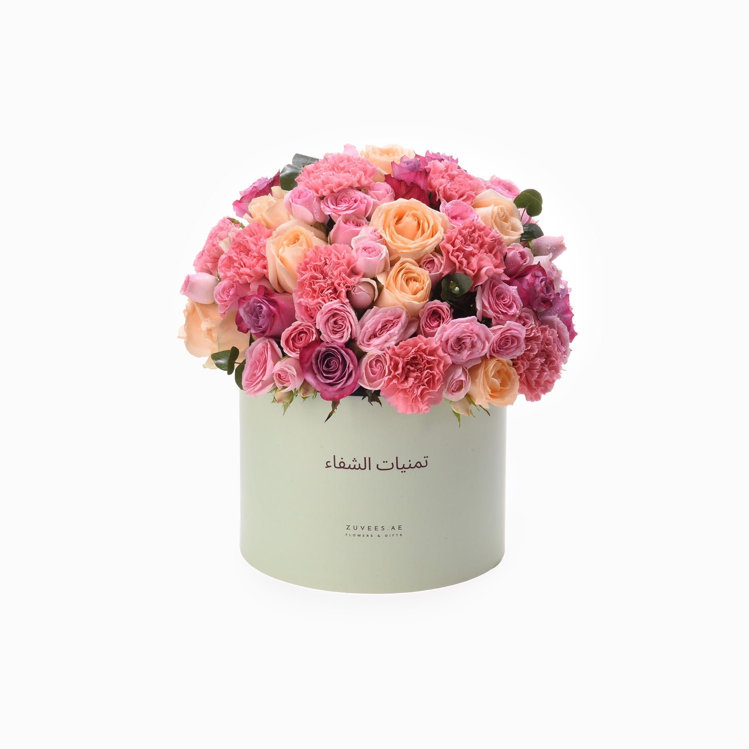Pastel pink and peach roses and carnations in mint green box.