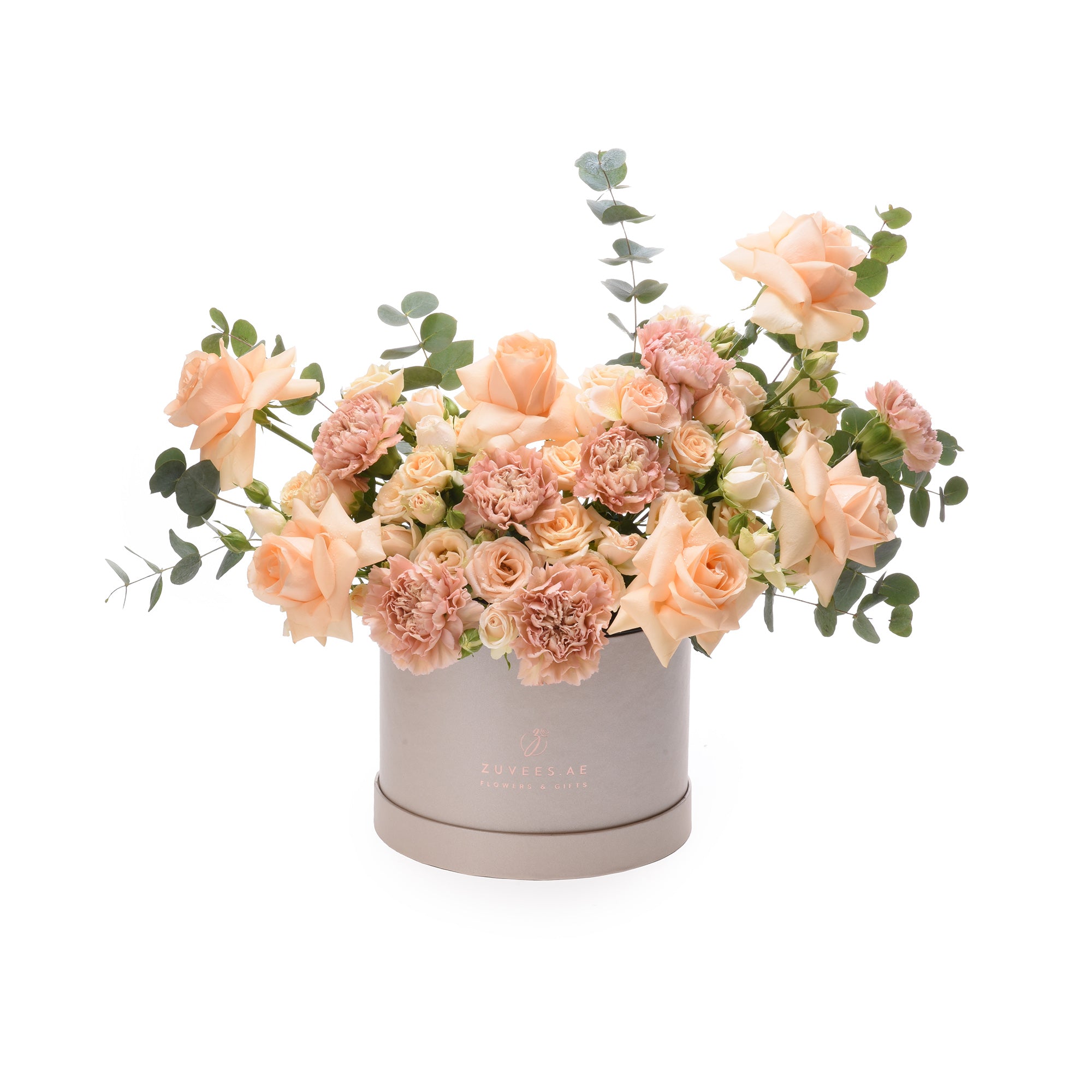 Soft peach roses and carnations in elegant grey box with eucalyptus.