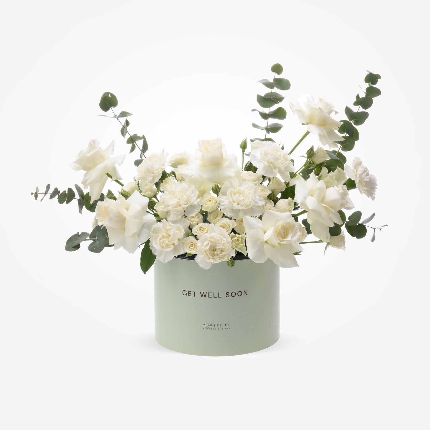 Soft white roses and eucalyptus in mint-green "Get Well Soon" gift box.