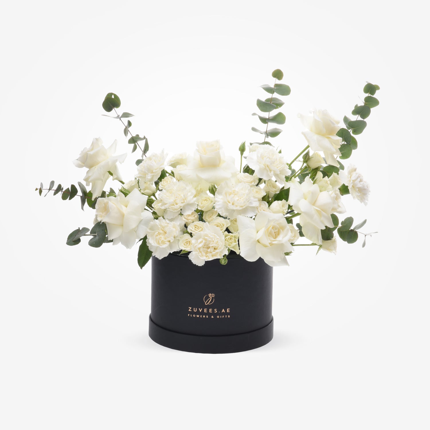 Elegant white roses and carnations with eucalyptus in a black Zuvees.AE gift box.
